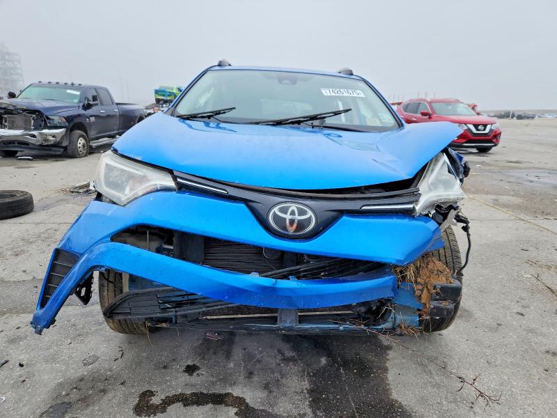 Photo 5 from auction – 2018 TOYOTA RAV4 LE with VIN JTMZFREV2JJ190488