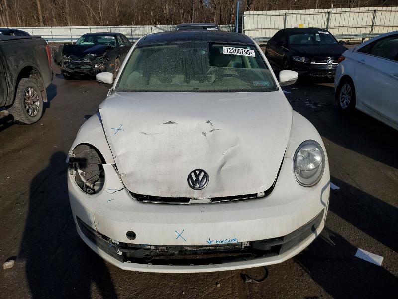 Photo 5 from auction – 2014 VOLKSWAGEN BEETLE with VIN 3VWJ17AT4EM657856