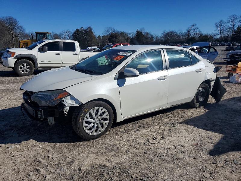 TOYOTA COROLLA L 2018 with VIN 5YFBURHE7JP744364 - Photo from auction