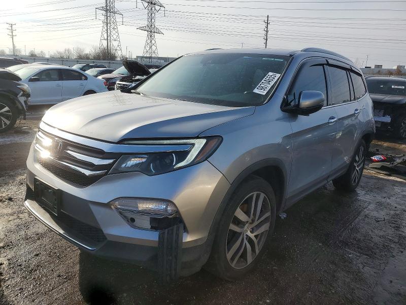 HONDA PILOT TOUR 2016 with VIN 5FNYF6H90GB063134 - Photo from auction