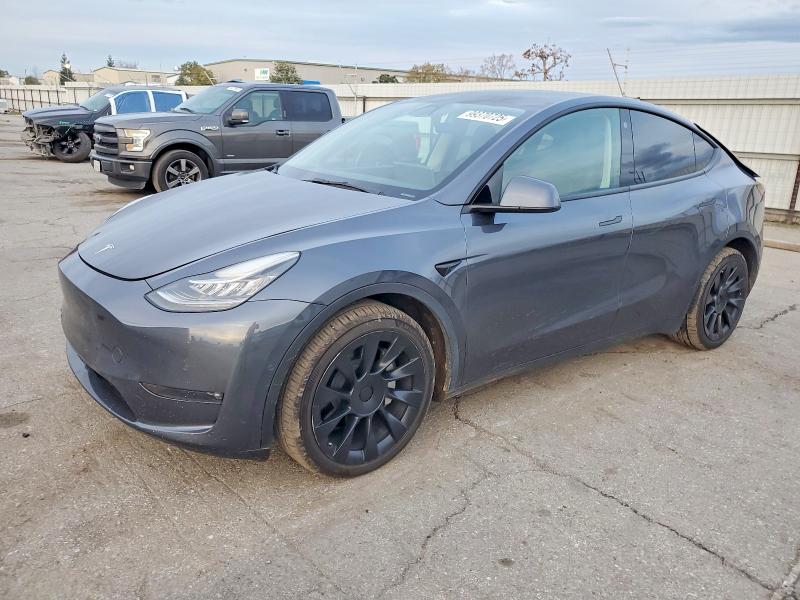 TESLA MODEL Y 2022 with VIN 7SAYGDEE4NF419877 - Photo from auction