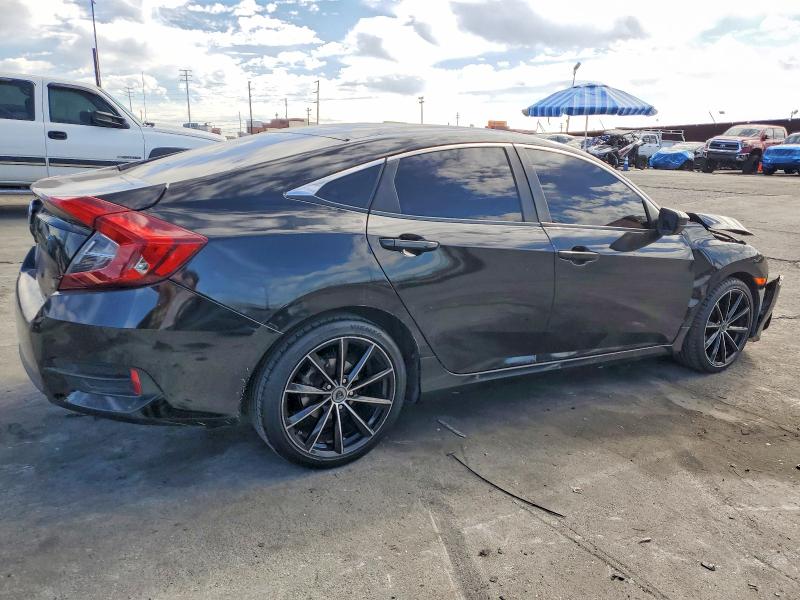 Photo 3 from auction – 2017 HONDA CIVIC LX with VIN 2HGFC2F51HH558027