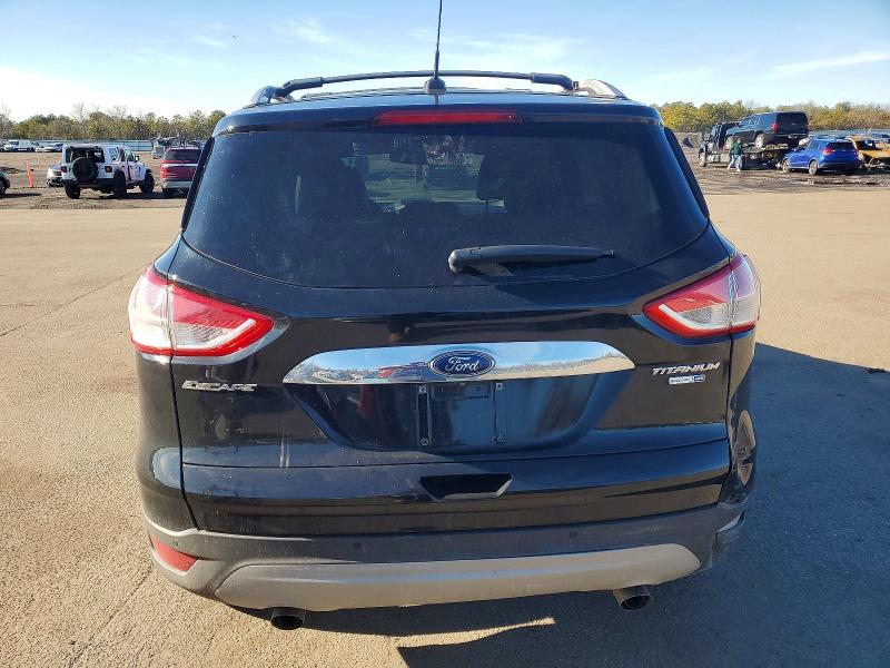 Photo 6 from auction – 2016 FORD ESCAPE TIT with VIN 1FMCU9JX9GUB50804