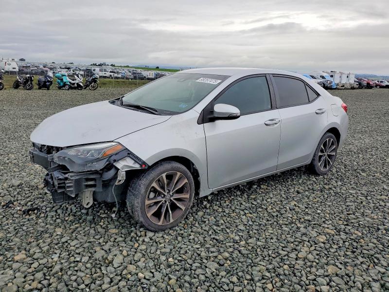 TOYOTA COROLLA L 2017 with VIN 5YFBURHE4HP717066 - Photo from auction