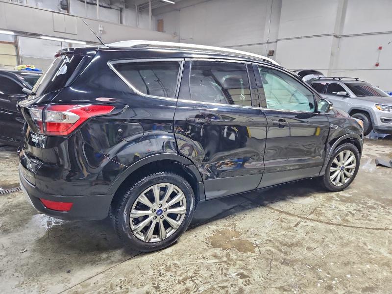 Photo 3 from auction – 2017 FORD ESCAPE TIT with VIN 1FMCU9J98HUE95650