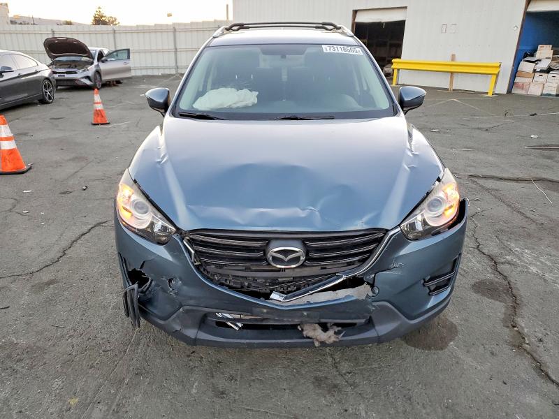 Photo 5 from auction – 2016 MAZDA CX-5 SPORT with VIN JM3KE2BYXG0876083