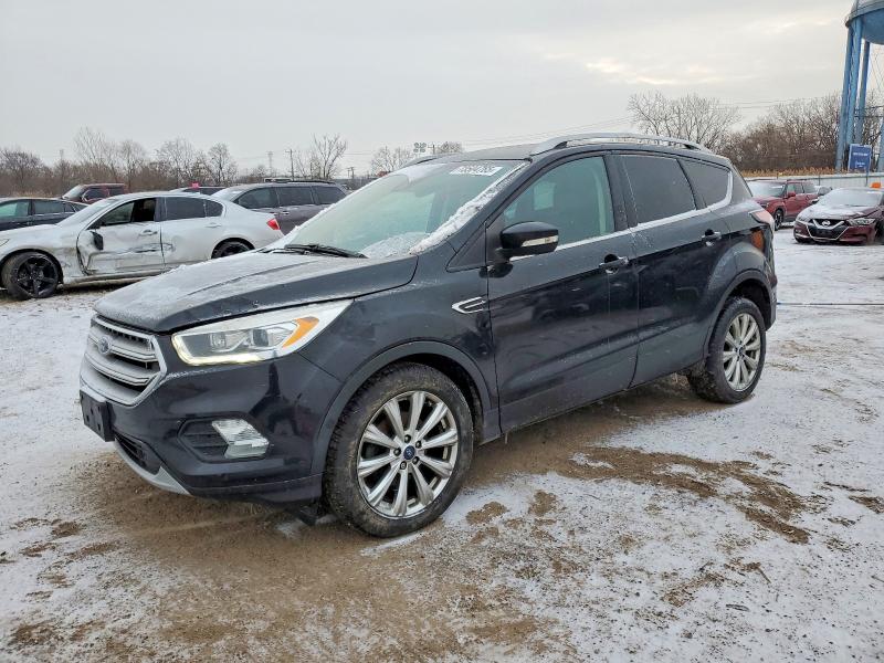 FORD ESCAPE TIT 2017 with VIN 1FMCU0JD1HUA48772 - Photo from auction