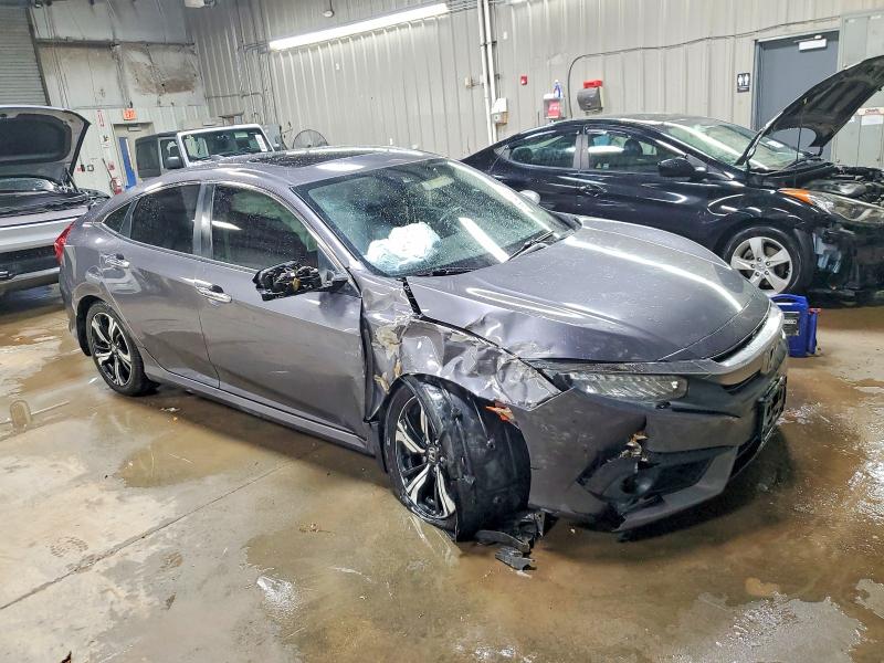 Photo 4 from auction – 2016 HONDA CIVIC with VIN 2HGFC1F98GH636573