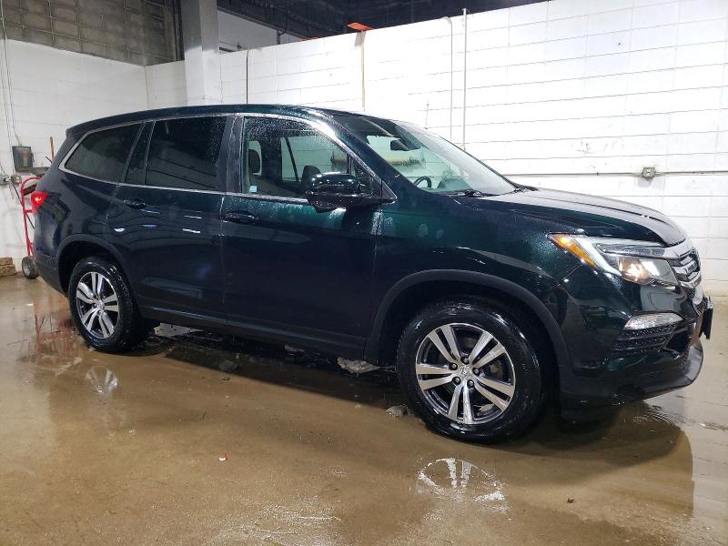 Photo 4 from auction – 2016 HONDA PILOT EXL with VIN 5FNYF6H59GB029254