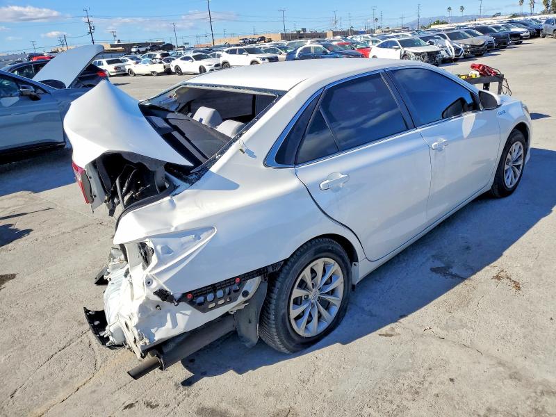 Photo 2 from auction – 2016 TOYOTA CAMRY HYBR with VIN 4T1BD1FK1GU185010