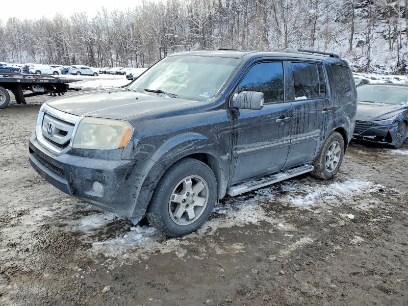 HONDA PILOT TOUR 2010 with VIN 5FNYF4H84AB017454 - Photo from auction