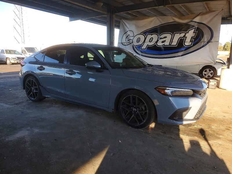 Photo 4 from auction – 2022 HONDA CIVIC SPOR with VIN 19XFL1H85NE024116