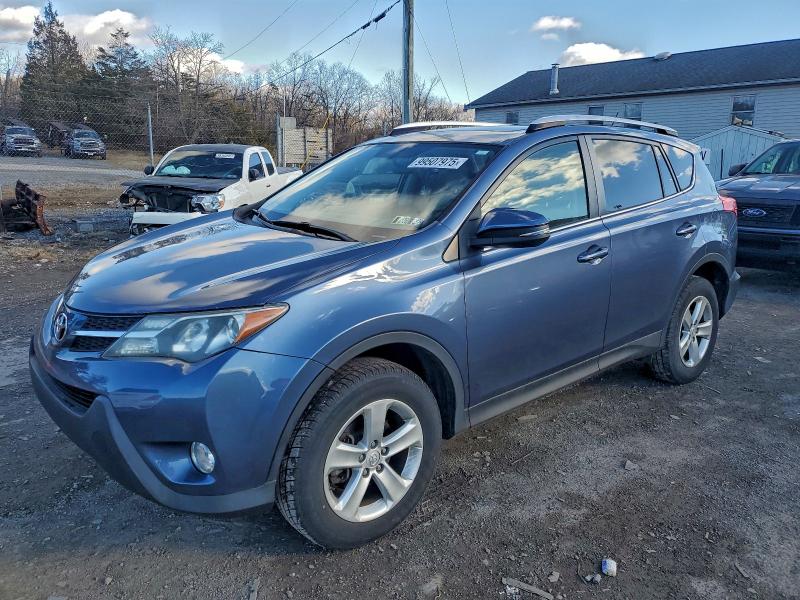 TOYOTA RAV4 XLE 2014 with VIN JTMRFREV1ED090550 - Photo from auction
