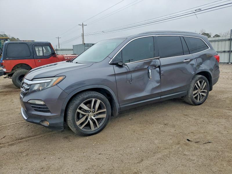 HONDA PILOT TOUR 2016 with VIN 5FNYF6H95GB081192 - Photo from auction
