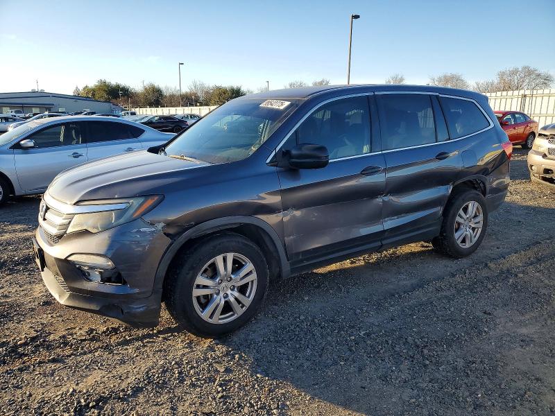 HONDA PILOT LX 2016 with VIN 5FNYF5H11GB033323 - Photo from auction