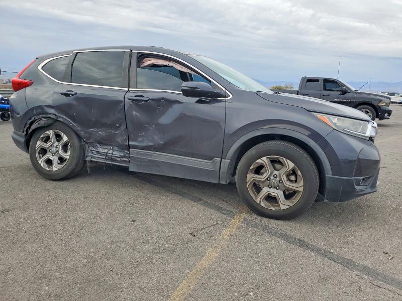 Photo 4 from auction – 2018 HONDA CR-V with VIN 7FARW1H52JE053270