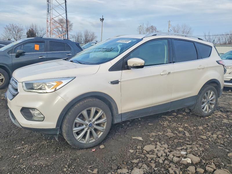 FORD ESCAPE TIT 2017 with VIN 1FMCU0J93HUB20714 - Photo from auction