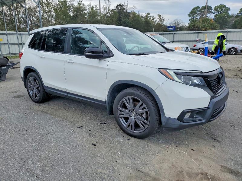 Photo 4 from auction – 2021 HONDA PASSPORT E with VIN 5FNYF7H57MB003009