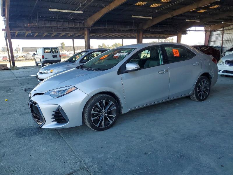 TOYOTA COROLLA L 2017 with VIN 5YFBURHE5HP648405 - Photo from auction