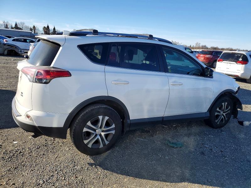 Photo 3 from auction – 2018 TOYOTA RAV4 LE with VIN JTMBFREV0JJ181497