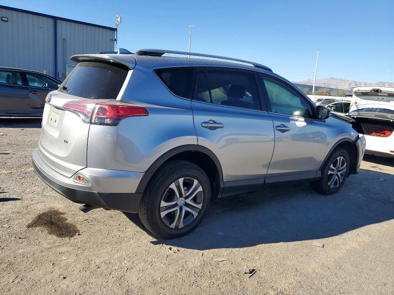 Photo 3 from auction – 2018 TOYOTA RAV4 LE with VIN JTMZFREV7JD131614