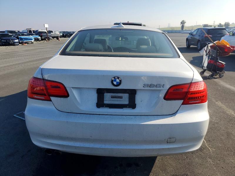 Photo 6 from auction – 2011 BMW 3 SERIES with VIN WBAKE5C55BE573008