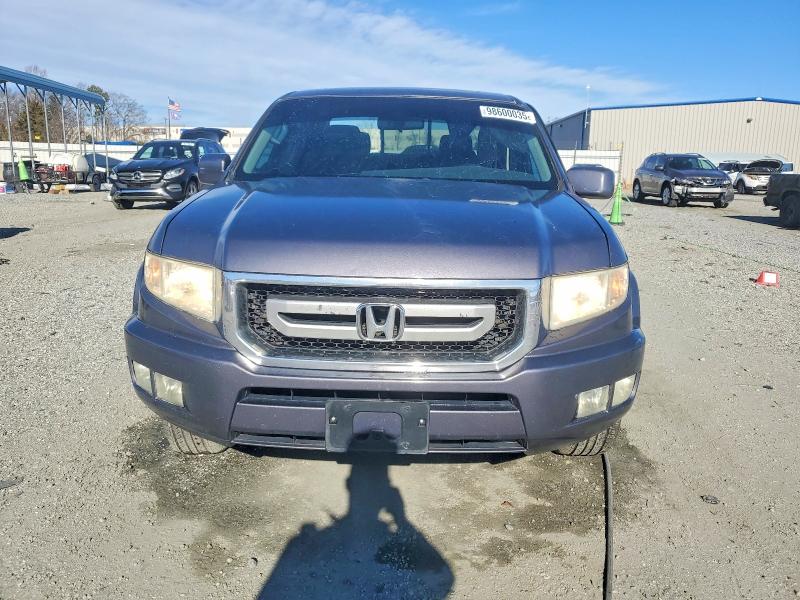 Photo 5 from auction – 2010 HONDA RIDGELINE with VIN 5FPYK1F54AB012801