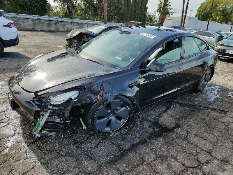 TESLA MODEL 3 2022 with VIN 5YJ3E1EB6NF297928 - Photo from auction
