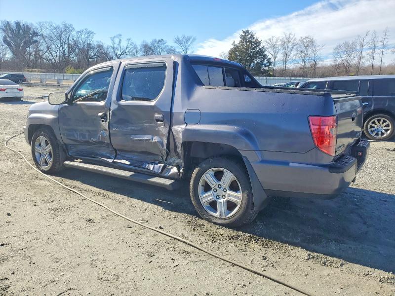 Photo 2 from auction – 2010 HONDA RIDGELINE with VIN 5FPYK1F54AB012801