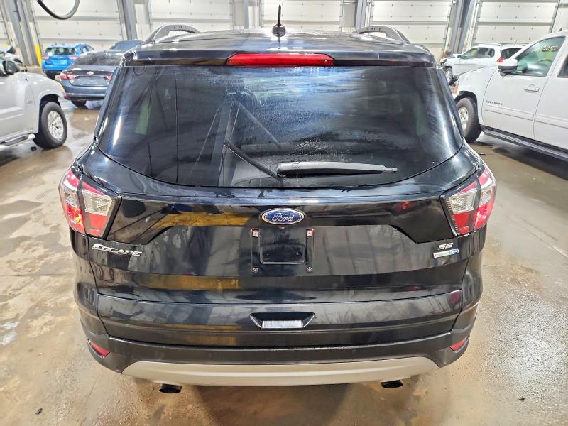 Photo 6 from auction – 2017 FORD ESCAPE SE with VIN 1FMCU9GD5HUD52182