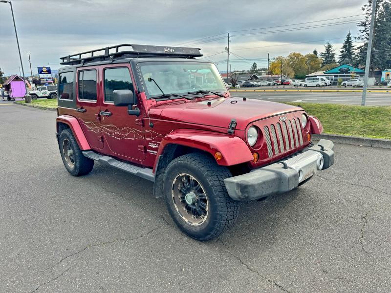JEEP WRANGLER U 2011 with VIN 1J4BA5H17BL593450 - Photo from auction