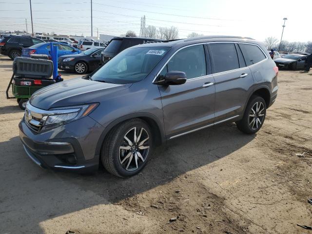 HONDA PILOT TOUR 2022 with VIN 5FNYF6H62NB061369 - Photo from auction