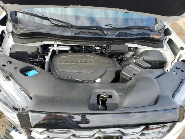 Photo 11 from auction – 2023 HONDA PASSPORT T with VIN 5FNYF8H69PB024690