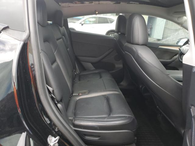 Photo 11 from auction – 2023 TESLA MODEL Y with VIN 7SAYGAEE6PF621251