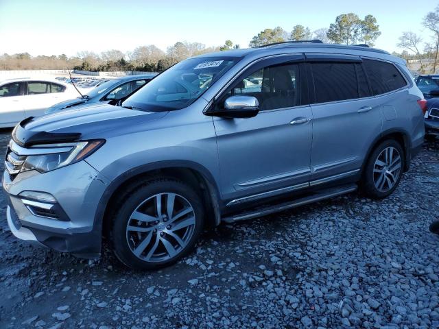 HONDA PILOT TOUR 2018 with VIN 5FNYF5H91JB014218 - Photo from auction