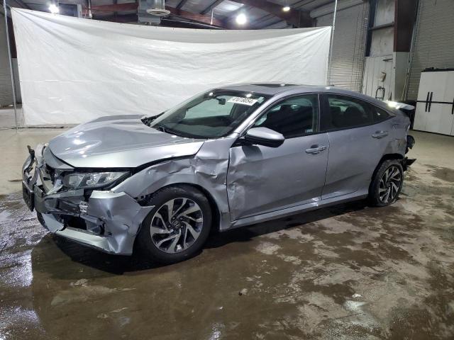 HONDA CIVIC EX 2018 with VIN 19XFC2F75JE203850 - Photo from auction