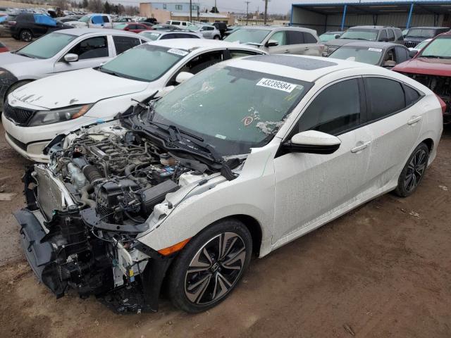 HONDA CIVIC EX 2018 with VIN JHMFC1F32JX020847 - Photo from auction