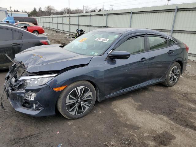 HONDA CIVIC EX 2018 with VIN JHMFC1F34JX043417 - Photo from auction