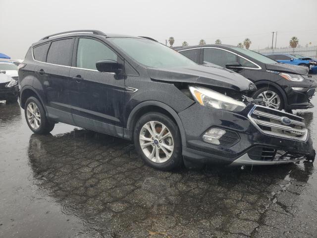 Photo 4 from auction – 2018 FORD ESCAPE SE with VIN 1FMCU0GD5JUA37285