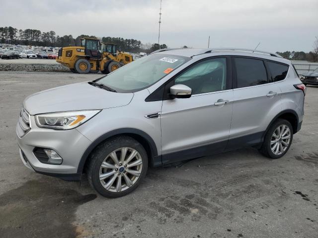 FORD ESCAPE TIT 2017 with VIN 1FMCU0JD9HUC22877 - Photo from auction