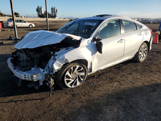 HONDA CIVIC EX 2018 with VIN 19XFC2F72JE208830 - Photo from auction