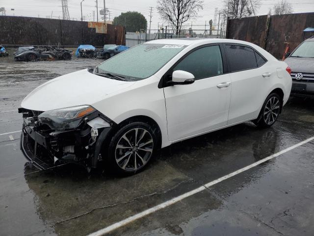TOYOTA COROLLA L 2017 with VIN 5YFBURHE0HP573550 - Photo from auction