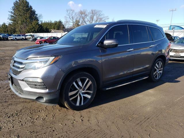 HONDA PILOT ELIT 2016 with VIN 5FNYF6H03GB121299 - Photo from auction