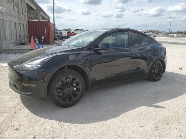 TESLA MODEL Y 2023 with VIN 7SAYGAEE7PF707734 - Photo from auction