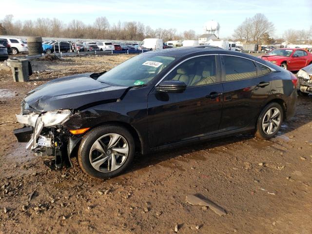 HONDA CIVIC LX 2018 with VIN 19XFC2F55JE209596 - Photo from auction