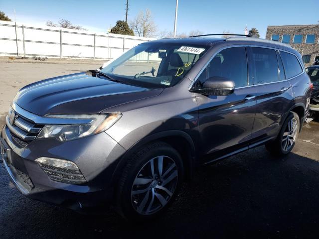 HONDA PILOT TOUR 2016 with VIN 5FNYF6H92GB085281 - Photo from auction