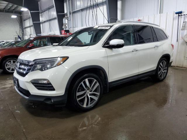 HONDA PILOT TOUR 2016 with VIN 5FNYF6H94GB030475 - Photo from auction