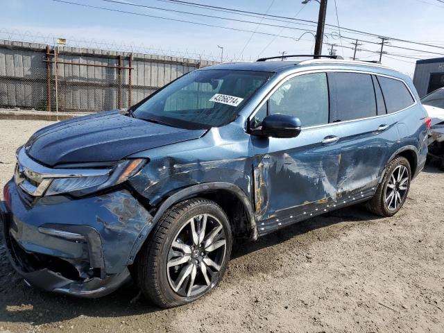 HONDA PILOT TOUR 2021 with VIN 5FNYF5H92MB001076 - Photo from auction