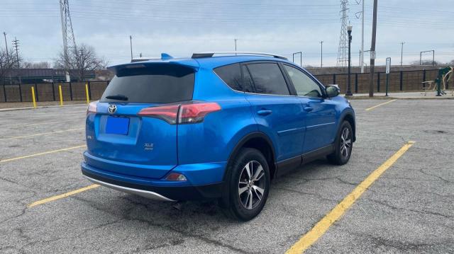 Photo 4 from auction – 2016 TOYOTA RAV4 XLE with VIN JTMRFREV7GJ102110