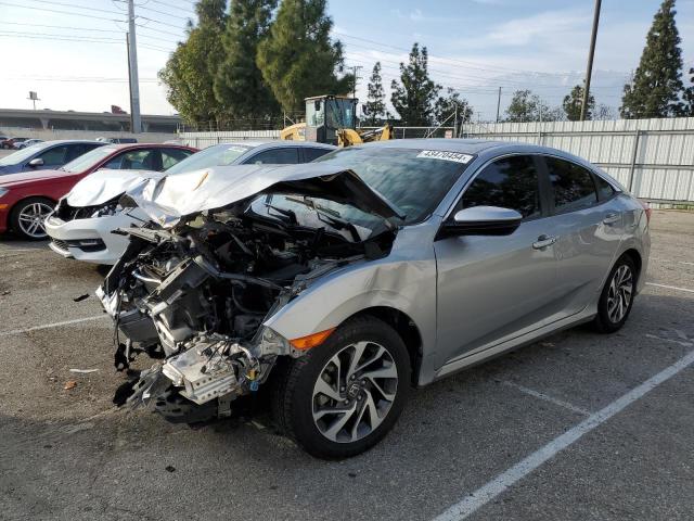 HONDA CIVIC EX 2017 with VIN 19XFC2F7XHE211128 - Photo from auction